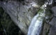 Al salt de Sallent de Rupit, l'aigua es precipita amb més força que mai quan arriba la primavera. A la foto, un escalador preparant-se per baixar la cinglera fent ràpel.