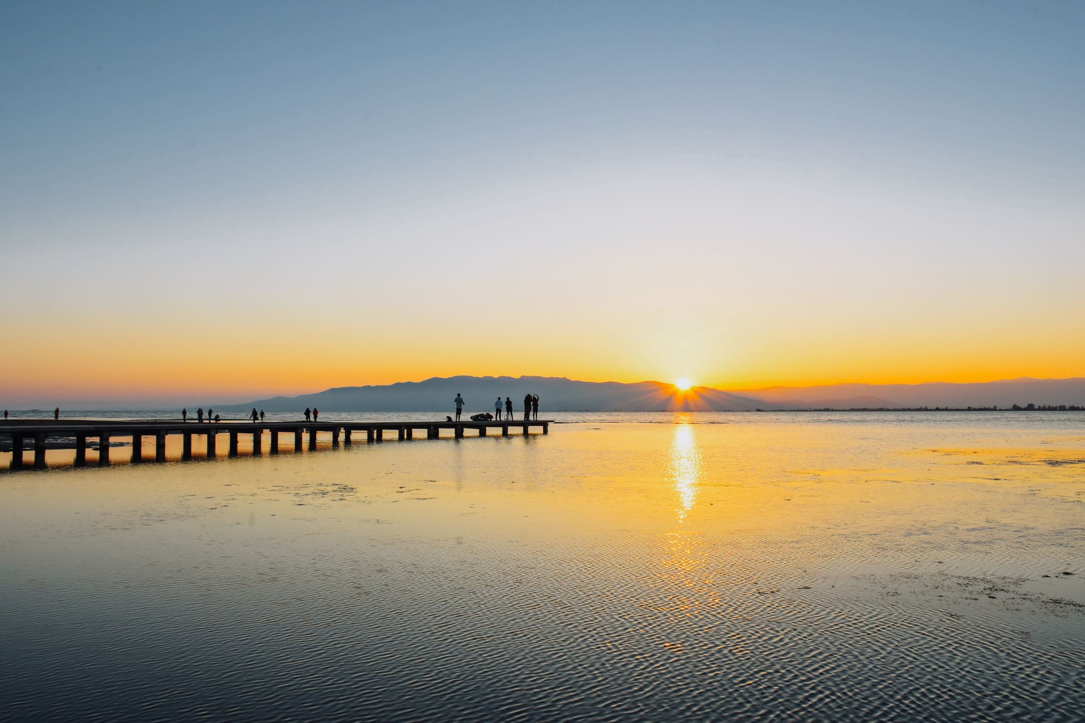 Posta de sol des de l’embarcador de la platja del Trabucador Posta de sol des de l’embarcador de la platja del Trabucador